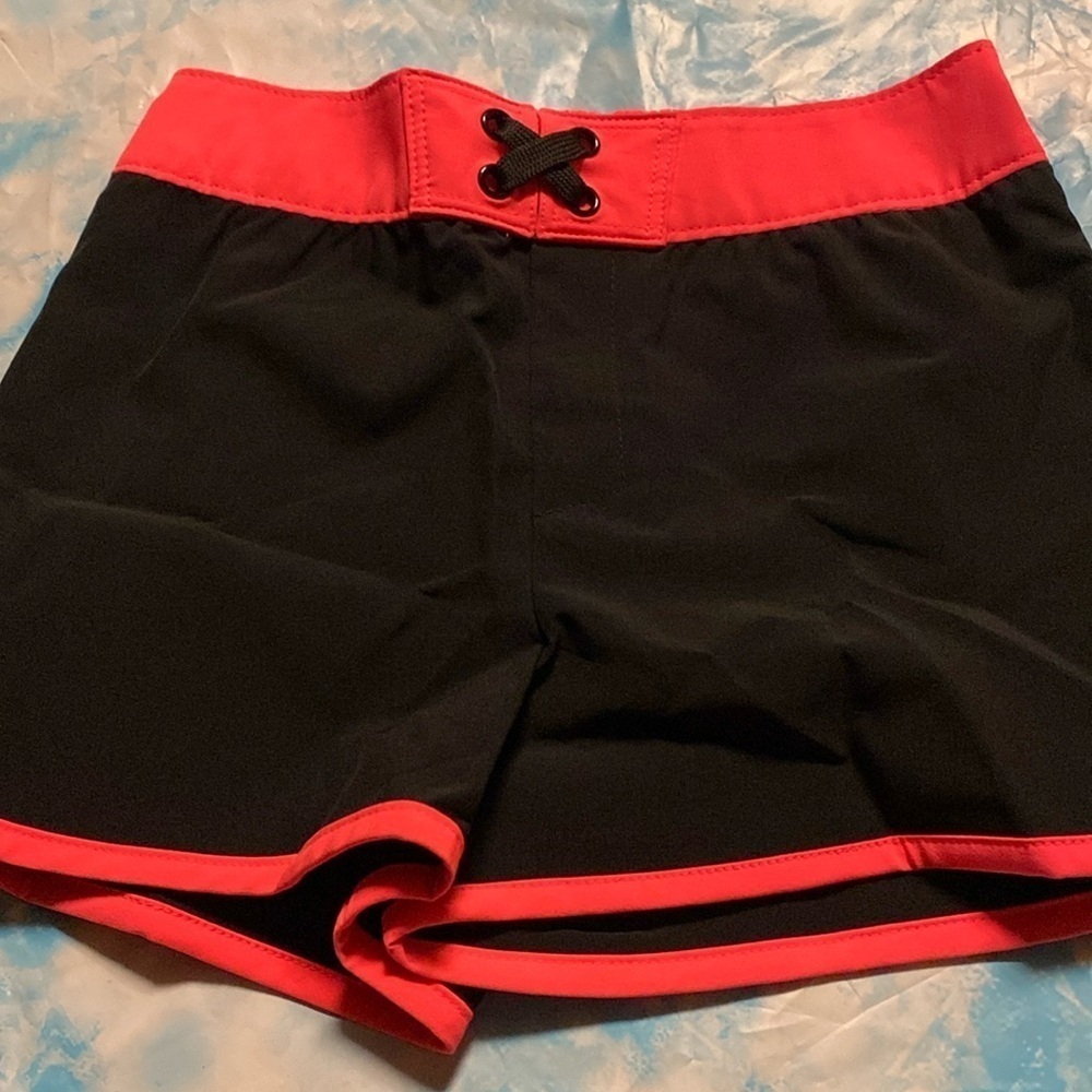 3/$20.  Girl’s Cat & Jack Swimming Shorts